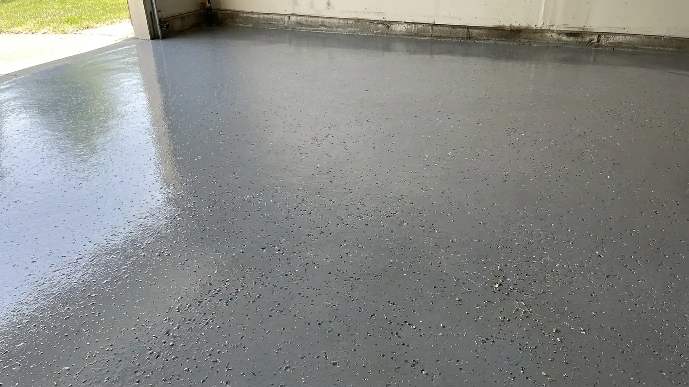 After: Stained garage floor coated | Music City Concrete After: a garage floor with a clean, glossy coated floor with decorative flecks